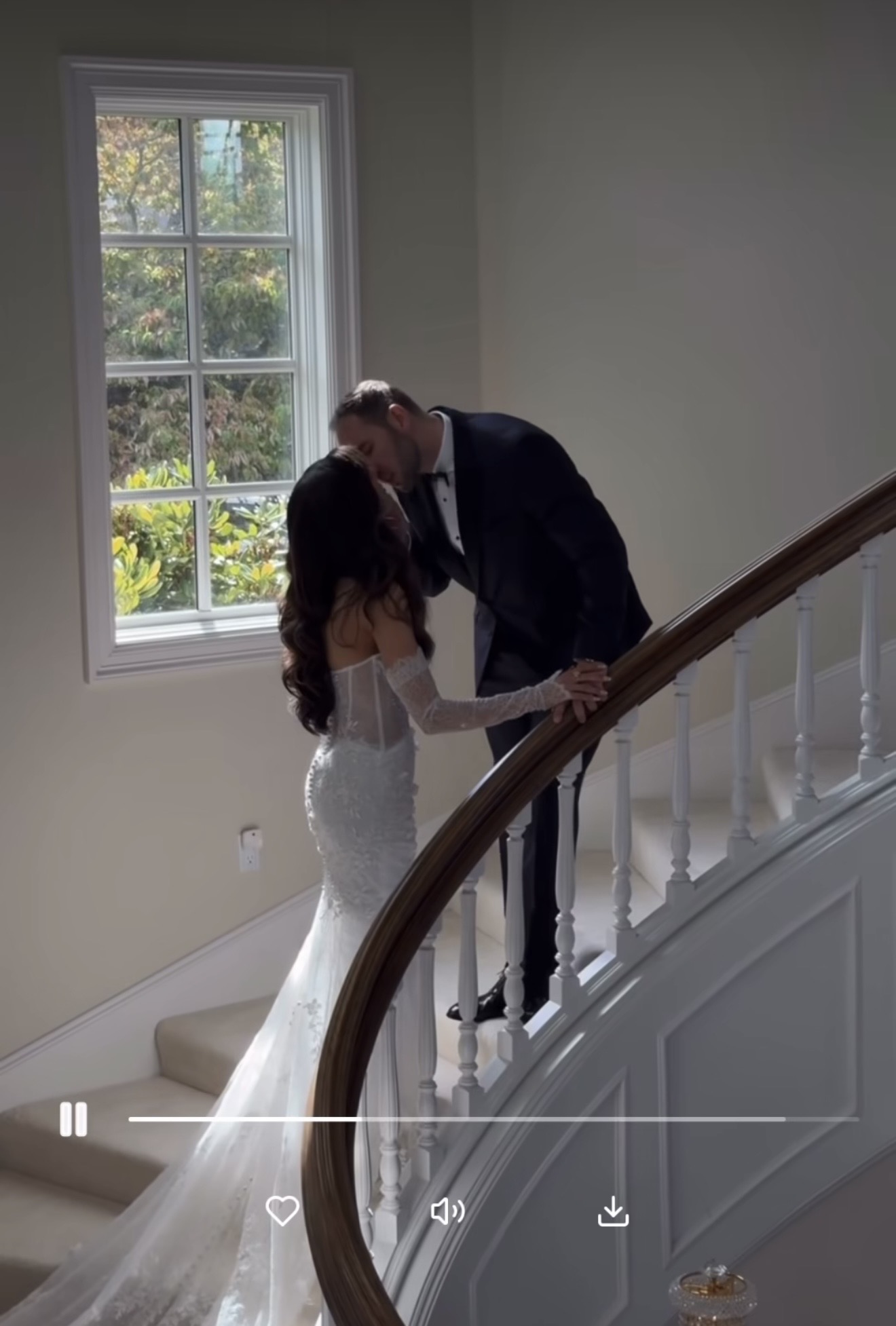 Couple sharing a kiss on a staircase, full screen in the gallery