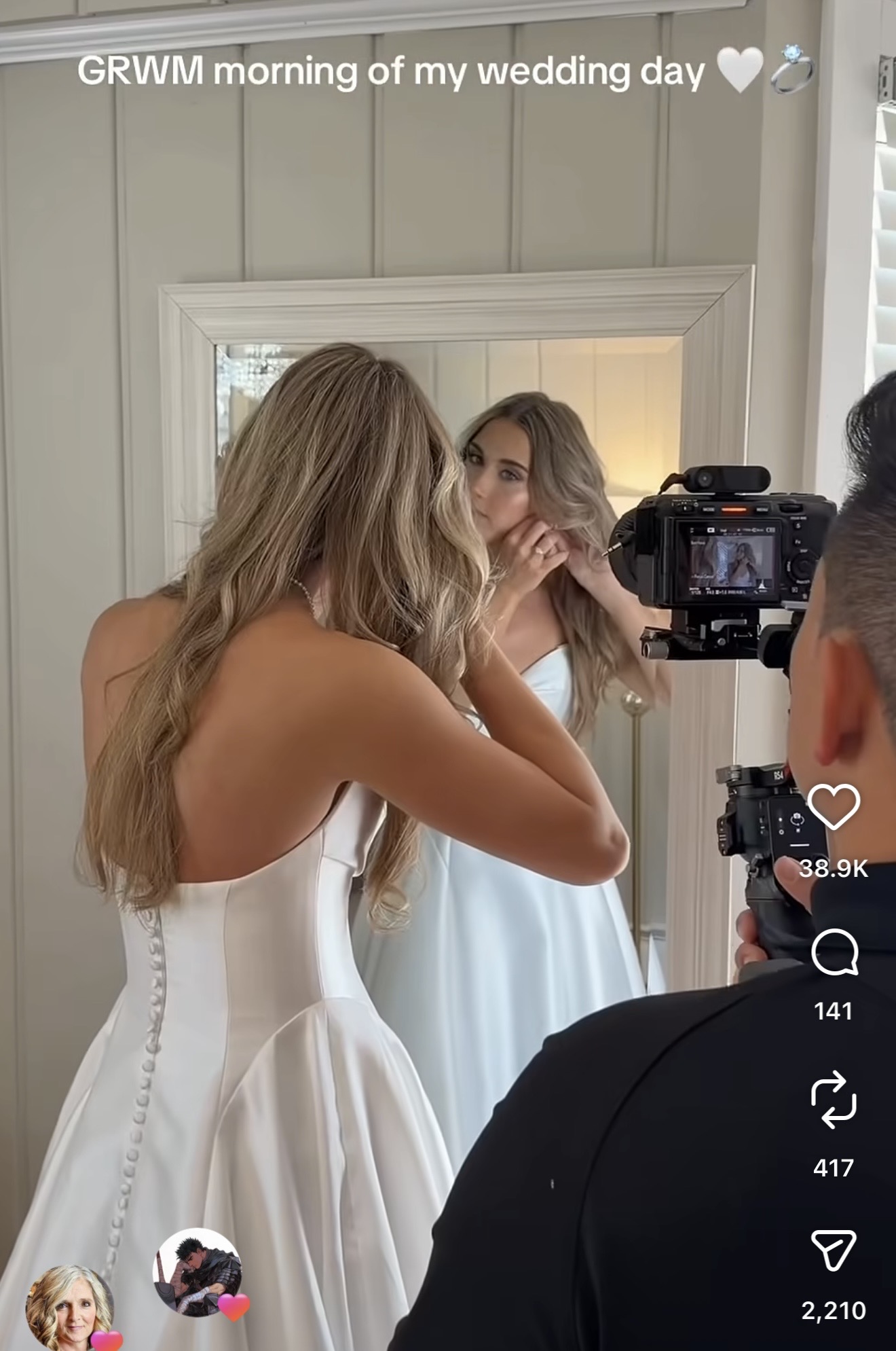Bride getting ready in front of a mirror while being filmed on the morning of her wedding