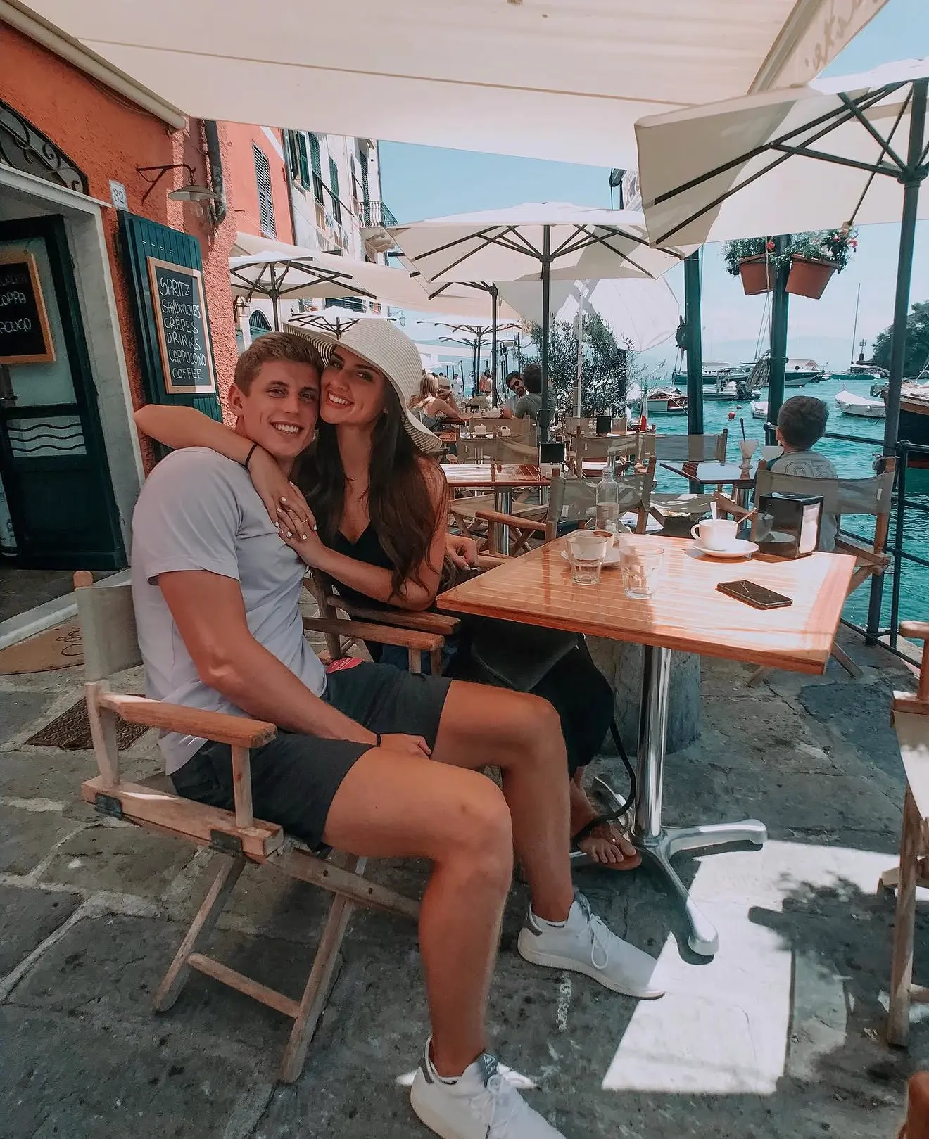Couple at a harbourside cafe in Portofino