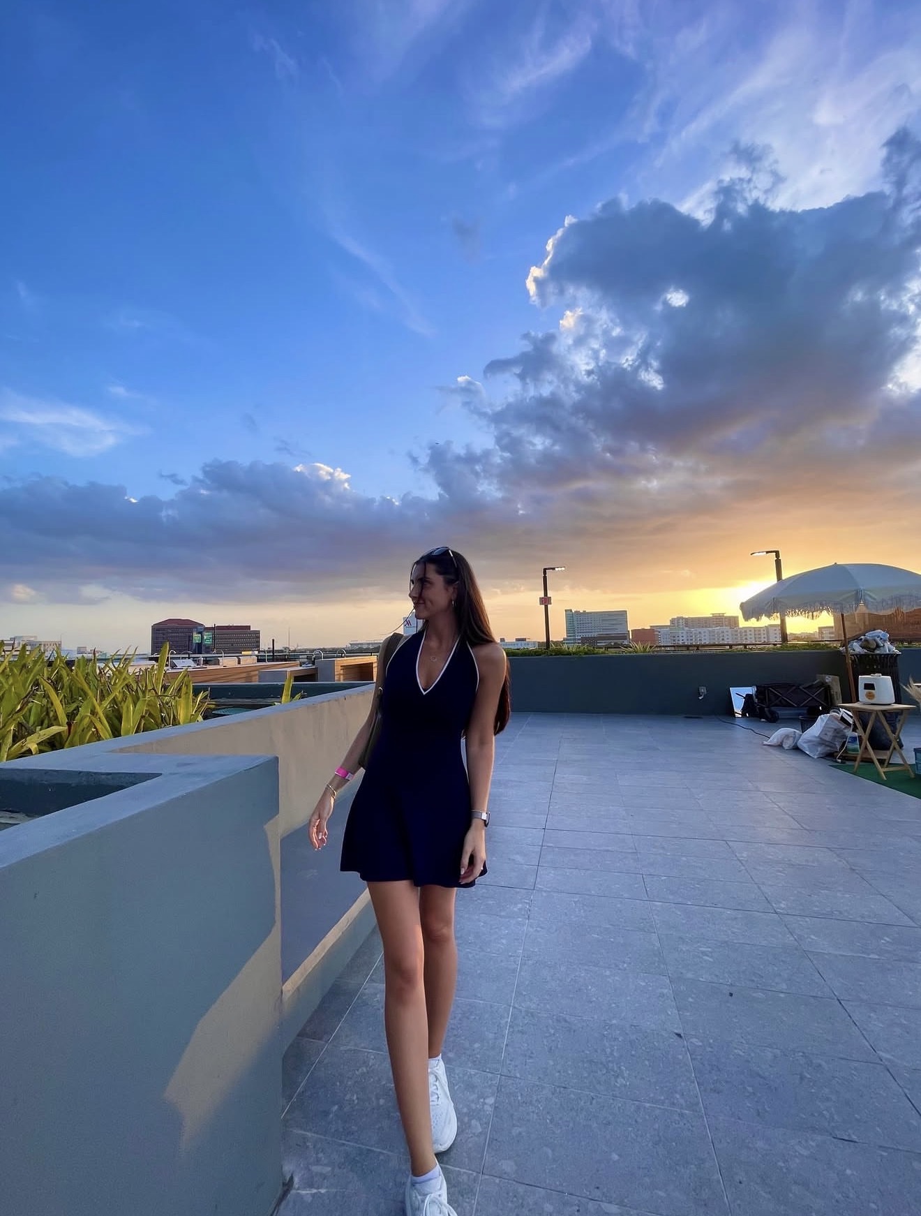 Lucia on a rooftop terrace at sunset
