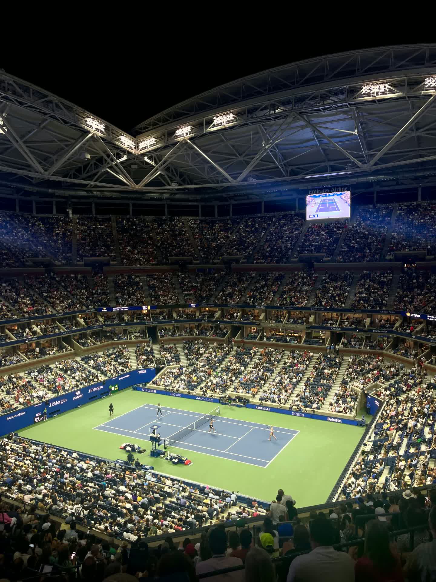 Arthur Ashe Stadium filled with fans during a US Open doubles match